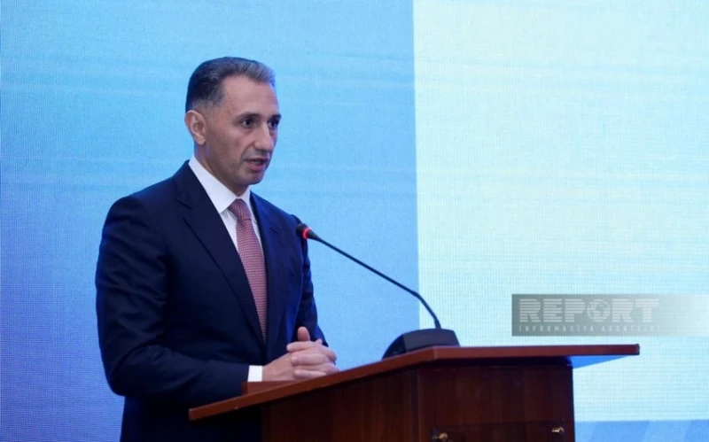 Rashad Nabiyev congratulates Zelim Tckaev on winning bronze at the World Championship